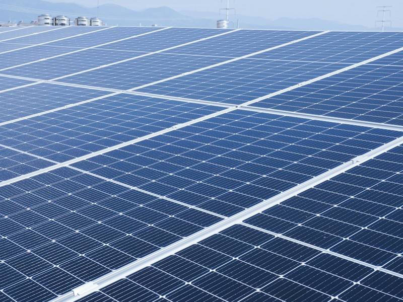 Large solar module against an open sky, representative image